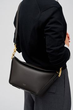 [vc_row][vc_column width=”1/3″][vc_column_text text_larger=”no”] Oroton Women’s Fable Day Bag   Oroton Fable Day Bag The Oroton Fable Day Bag, crafted from smooth leather with a 100% cotton twill lining. Adorned with brass colour hardware and the signature foil emboss logo, it offers an elegant touch. The bag features one spacious compartment with an internal zip pocket for organised storage. Designed with a removable top handle and an adjustable crossbody stra High-end Pouch Satchel For Formal Occasions, High-end Business Pouch Shoulder Bag, Modern Gold Shoulder Bag For Work, High-end Formal Pouch Shoulder Bag, Modern Formal Shoulder Bag With Gold-tone Hardware, Elegant Formal Bucket Bag With Detachable Handle, Classic Formal Bucket Bag With Double Handle, Elegant Double Handle Bucket Bag For Formal Occasions, Modern Gold Bucket Bag For Formal Occasions