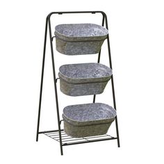 three buckets on a metal rack with two baskets in the bottom and one is empty