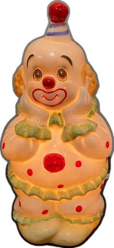 a ceramic clown figure is shown on a white background