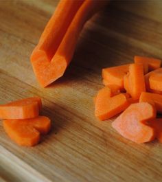 chopped carrots on a wooden cutting board