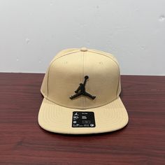 Brand - Jordan Hat Type - Snapback Hat Model - Pro Cap Style Code - Fd5184 200 Color - Tan & Black Condition - Brand New Age - Adult Sizes Available; Medium|Large Brown Flat Brim Baseball Cap For Sports, Brown Flat Brim Snapback Hat For Sports, Brown Flat Bill Sports Hat, Brown Flat Brim Sports Hat, Sports Flat Bill Hat In Brown, Sporty Brown Snapback Hat, Brown Casual Snapback Hat For Sports Events, Beige Adjustable Snapback Hat With Visor, Adjustable Beige Snapback Hat With Visor