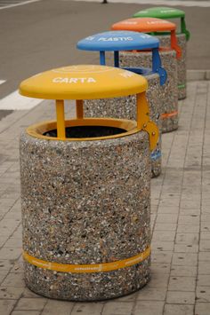 there are many different colored stools on the sidewalk