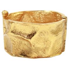 Vintage Yves Saint Laurent YSL Gold Tone Cuff Bracelet Circa 1990s. Classic cuff bracelet with indentations all around. Smaller in the front part and getting larger in the back. Has a great looking pin closure. Heavy and substantial. Spectacular! Diameter in the front is 2" and back is 2.5" Gold Cuff Bracelet For Evening, Ysl Gold, Saint Laurent Vintage, Vintage Yves Saint Laurent, Vintage Ysl, Gold Bracelet Cuff, French Artists, Cuff Bracelet, Yves Saint Laurent