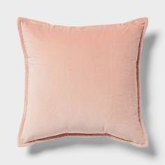 a pink pillow on a white background