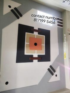 a wall that has some type of object on it with the words contact number 81799