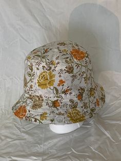 "Medium REVERSIBLE Autumn Floral Bucket Hat with Green Lining  *  Measurements:      -  top: 17 cm x 15.5 cm (6.75\" x 6\"); circumference: 52 cm (20.5\")    -  crown: 8.5 cm long (3.5\"); circumference: 59 cm (23.25\")    -  brim: 6.8 cm long (2.75\"); circumference: 80.5 cm (31.75\")  *  Brown Stitching ✨✨Made from THRIFTED/RECYCLED material" Handmade Vintage Adjustable Bucket Hat, Vintage Multicolor Bucket Hat, White Adjustable Vintage Bucket Hat, Reuse Fabric, Floral Bucket Hat, Bucket Hats, Hat Making, Green Cotton, Floral Flowers