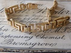 Gorgeous vintage 1980s 18ct gold plated GRECIAN chain link bracelet...the stunning bracelet is in fabulous condition and measures 19cm in length x 0.8cm in depth...the box is for display, however the wonderful vintage gold bracelet will arrive beautifully gift wrapped xx Vintage Gold-tone Gold-plated Bracelet, Vintage Gold-plated Yellow Gold Bracelet, Vintage Gold-plated Jubilee Bracelet, Vintage Yellow Gold-plated Bracelet, Vintage Gold Plated Bracelets For Formal Occasions, Vintage Yellow Gold Plated Bracelet, Vintage Yellow Gold Bracelet With Rectangular Links, Vintage Gold Chain Bracelet For Anniversary, Vintage Yellow Gold Hallmarked Chain Bracelet