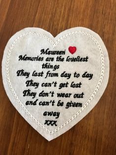 a heart shaped embroidered on top of a wooden table