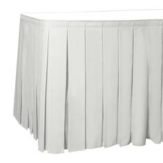 a white table skirt with pleated edges