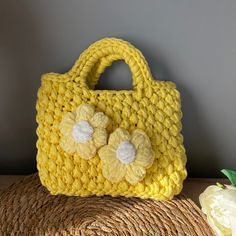 This crochet yellow clutch bag offers a special design that stands out with unique floral details and durable combed cotton fabric. Whether you use it in daily life or choose it to complete your elegance in special occasions, this bag will always accompany you. It is carefully woven with handmade crochet technique, there is effort and love in every detail. Its bright yellow color provides an energetic and lively appearance. Floral embellishments make the bag create a romantic and elegant atmosph Yellow Crochet Tote Bag For Spring, Yellow Crochet Bag For Spring, Spring Yellow Crochet Bag, Yellow Crochet Rectangular Bag, Yellow Crochet Rectangular Shoulder Bag, Spring Yellow Cotton Shoulder Bag, Handmade Yellow Cotton Shoulder Bag, Handmade Yellow Crochet Pouch Bag, Handmade Yellow Crochet Bag For Gift