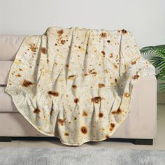 a tortilla blanket sitting on top of a couch