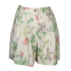 Upgrade your wardrobe with the Elena Floral Print Shorts. The fun, Carribean-inspired pleated short features a high waist, horn buttons, and side pockets. This relaxed-fitting short is composed of silky linen fabric with a touch of spandex for added stretch.   Front zipper and single button closure Horn buttons Belt loops Orange, sand, green, and indigo floral print Back and side pockets  Pair with a white tank and sandals, or with the matching Elena Cami and Elena Blazer Vest. 59% Linen, 38% Vi Floral Print Relaxed Fit Shorts, Multicolor Floral Print Shorts, Multicolor Floral Print Beachwear Shorts, Beach Floral Print Mini Shorts, Indigo Floral, Beach-style Mini Shorts With Floral Print, Summer Color Palette, Brand Magazine, Stocking Fillers For Her