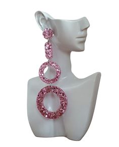 Sparkly Long Oversized Pink Blush Hoop Circle Resin Earrings  Material: Stainless steel, resin, glitter  Colour: pink Size: 112mm length drop X 46mm wide If you like light weight comfortable earrings then these are for you. Sparkly you can wear everyday or a night out. All metals are made with stainless steel which is perfect for sensitive ears and never changes colour. Sparkling Round Earrings For Party, Sparkling Pink Jewelry For Party, Sparkling Round Party Earrings, Pink Glitter Drop Earrings, Pink Drop Chandelier Earrings For Party, Pink Crystal Drop Earrings For Party, Pink Hoop Earrings For Party, Pink Crystal Earrings For Party, Pink Bling Drop Crystal Earrings