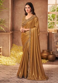 Golden silk saree with blouse 903  Desc:  Color : Golden Fabric : Silk Work : Sequins   Embroidery Wash Care : Dry clean Sleeve Style : Half Sleeve Long Sleeves : Done only in Custom Stitch Sleeves Lining : Done only in Custom Stitch Bust Size : 32 to 42 Inches Occasion : Wedding   Kitty Party   Mehendi   Sangeet   Party Wear   Engagement   Reception   Ceremonial. With Express Free Shipping and Custom Stitching, Buy Eid Special Saree Party wedding wear dresses Golden silk saree with blouse 903 o Shimmer Saree, Reception Saree, Party Wear Sarees Online, Party Sarees, Plain Saree, Utsav Fashion, Satin Saree, Party Kleidung, Brown Satin