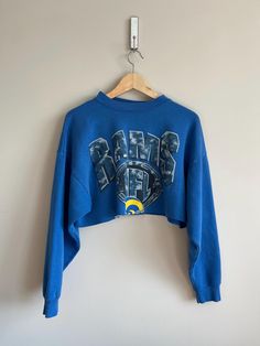 2000 vintage super trendy LA Rams NFL football sweatshirt cropped  authentic vintage crewneck  You will be the only one who has this trendy LA rams vintage sweatshirt :) vintage wear and character as pictured  no pilling great vintage condition very soft Size medium cropped it fits super cute model is 5'5 normally wears a size small Y2k Sweatshirt, Super Bowl Champions, La Rams, Vintage Crewneck, Football Sweatshirt, Football Nfl, Sweatshirt Vintage, Vintage Wear, Nfl Football