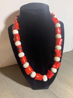 Handcrafted Red Bamboo Coral & White Howlite beaded necklace with a bronze lobster claw closure. This one-of-a-kind necklace measures 20 inches. Red Bamboo Coral gets its name from its similarity to bamboo stalks. It promotes creativity and prosperity. Howlite is known to promote inner peace and to calm emotions during times of change. Please note: stones may appear slightly different when viewed in different lighting. Red Gemstone Beads Necklace, Unique Red Beaded Necklaces With Gemstone Beads, Unique Red Gemstone Beaded Necklaces, Unique Red Gemstone Bead Necklaces, Adjustable Single Strand Beaded Necklace In Red Coral, Unique Single Strand Red Beaded Necklace, Unique Red Single Strand Beaded Necklace, Red Coral Hand-strung Necklace As A Gift, Gift Red Coral Hand-strung Necklace