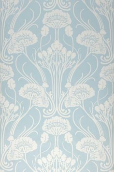 a white wallpaper with an ornate design on it