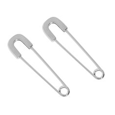 two metal tongs sitting on top of each other