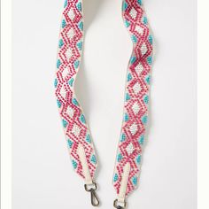 a pink and blue lanyard with silver hardware on a white background that is also used as a leash for dogs