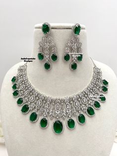 American Diamond Necklace Set/CZ Necklace/ Reception Jewelry/Statement Necklace Set/silver green     All items are shipped from Brampton, Ontario, Canada. If you need your item by a certain day, please reach out to us for express delivery option before placing the order so that we can update the shipping for you. Standard shipping/delivery timeline Below are the delivery timeline estimates once the order is shipped. ---> USA delivery timeline * 3-6 business days to major urban centers in USA. It Emerald Necklace With Diamonds And 17 Jewels, Formal Green Emerald Diamond Necklace, Green Jeweled Necklace For Anniversary, Green Jeweled Necklaces For Anniversary, Dazzling Green Emerald Necklace For Formal Occasions, Dazzling Green Emerald Necklace For Anniversary, Green Oval Jeweled Jewelry, Dazzling Green Emerald Necklace, Dazzling Green Diamond Necklaces