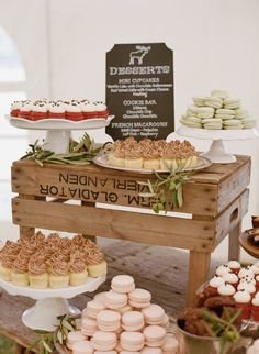 an assortment of desserts displayed on wooden crates