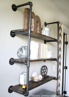 an industrial pipe shelving unit in the corner of a room