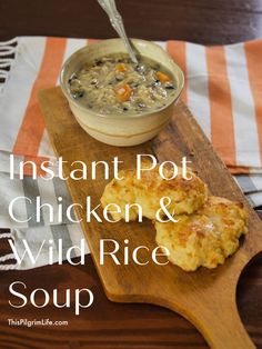 instant pot chicken and wild rice soup on a cutting board with a spoon in it