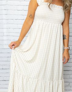 Get your boho-chic on with our Mel Dress! This playful maxi features a smocked top for a perfect fit, while the plaid print and ruffled hem add a touch of whimsy. Perfect for any occasion, this dress will have you feeling stylish and comfortable. 100% Polyester Smocked Top, Shoe Gifts, Romper Dress, Skirt Leggings, Plaid Print, Cardigan Jacket, Dress Romper, Denim Pants, Short Tops