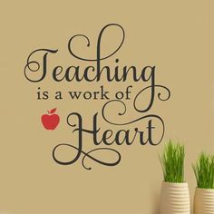 a wall decal with the words teaching is a work of heart and an apple