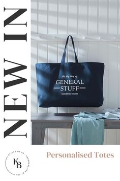 a blue bag sitting on top of a wooden table next to a white wall with the words, personalized totes