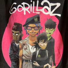 AB Band: Gorillaz  Size:  20" pit to pit  &      24" collar to bottom  Colors: black  Condition: excellent collar is cut  Date : 6/29/24 **all of our shirts are PRE-OWNED and may contain normal wear, fading, stains or imperfections, holes, tears, loose or missing threads. We will do our best to point out significant issues. Thank you for looking!! #tshirt #fashion #clothing #streetwear #shirt Black Punk T-shirt With Character Print, Black Alternative Style Top For Fans, Alternative Character Print Top For Streetwear, Black Punk T-shirt For Fan Merchandise, Black Grunge T-shirt For Fan Merchandise, Black Grunge Style T-shirt For Fan Merchandise, Black Band Logo T-shirt For Alternative Fashion, Alternative Fashion Crew Neck T-shirt With Character Print, Black T-shirt With Graphic Design For Alternative Fashion