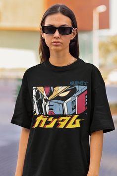 Unisex, Gundam Shirt, 90s Anime Shirt, Vintage Shirt, Robot Anime Lovers Tee, Anime T-shirt, Japanese Manga Tshirt, Retro Gundam Anime Shirt The unisex heavy cotton tee is the basic staple of any wardrobe. It is the foundation upon which casual fashion grows. All it needs is a personalized design to elevate things to profitability. The specially spun fibers provide a smooth surface for premium printing vividity and sharpness. No side seams mean there are no itchy interruptions under the arms. Th Gundam Tshirt Design, 90s Anime Print Crew Neck T-shirt, Pop Culture Anime Print Crew Neck Tops, Retro Anime Print Tops For Streetwear, 90s Anime Print Crew Neck Top, Retro Black Anime Print Tops, 90s Anime Print Short Sleeve T-shirt, Black Retro Anime Print Top, Black Retro Top With Anime Print