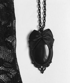 Gothic Necklace Cameo Necklace Black stone Necklace Creepy Jewelry Part of the Dark Elegance Collection- more in my shop Beautiful black chain necklace featuring a black stone in a delicate detailed frame pendant. The frame pendant is 2.4 x 4cm. Optional satin bow. The chain has a 5cm extended chain and fastens with a black lobster clasp. I offer FREE product customization. Can be made with a shorter/longer chain by request, Items are placed in a cute organza bag for free! Lilacat Designs aims f Creepy Necklace, Creepy Jewelry, Black Stone Necklace, Black Chain Necklace, Dark Elegance, Gothic Chokers, Bead Charms Diy, Gothic Necklace, Cameo Necklace