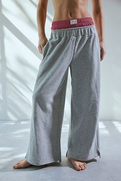 Cozy-cool Out From Under sweatpant in a relaxed, wide-leg silhouette. Designed with a mid-rise elasticated waistband made special with a layered boxer waistline topped with a branded patch. Exclusively at Urban Outfitters. Features Out From Under Hoxton layered boxer wide leg sweatpant Wide leg lounge pant Soft midweight knit Mid-rise layered elasticated waist Out From Under patch at the front Side pockets Wide leg fit Cropped length Easy pull-over style UO exclusive Content + Care 58% Cotton, 42% polyester Machine wash Imported Size + Fit Model in Grey is 5’9.5" and wearing size Small Measurements taken from size Small Waist: 24" Inseam: 26" | Out From Under Hoxton Layered Boxer Wide Leg Sweatpant in Grey, Women's at Urban Outfitters Comfortable Pull-on Leisure Bottoms, Casual Wide Leg Pants For Fall Loungewear, Comfy Pants With Elastic Waistband, Relaxed Fit Solid Wide Leg Pants For Winter, Wide Leg Cotton Pants With Ribbed Waistband, Comfy Wide-leg Pants With Elastic Waistband, Comfy Wide Leg Sweatpants For Spring, Comfy Wide-leg Spring Sweatpants, Winter Wide Leg Pants Solid Relaxed Fit