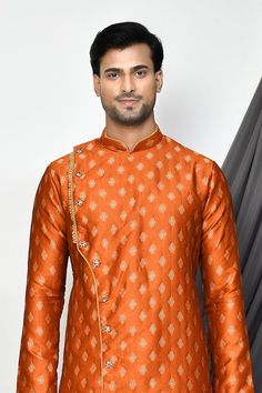 Orange full sleeve kurta with floral jacquard woven motifs and mandarin collared neckline. Paired with cream dhoti pant. - Aza Fashions Ceremonial Kurta With Traditional Patterns And Long Sleeves, Designer Festive Kurta With Traditional Patterns, Traditional Long Sleeve Jamawar Churidar, Traditional Banarasi Silk Salwar Kameez With Long Sleeves, Designer Long Sleeve Jamawar Kurta, Traditional Long Sleeve Art Silk Wear With Self Design, Long Sleeve Traditional Wear With Patterns For Ceremonial Use, Festive Traditional Wear With Long Sleeve Zari Weaving, Traditional Jamawar Churidar With Long Sleeves