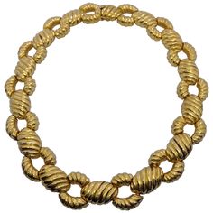 This beautiful necklace is designed by Zolotas of Athens, Greece. Founded in 1895 the company merges Greek heritage with modern style to create these timeless pieces which have since been Coveted by both Royals and Actresses. Composed of 22 karat yellow gold, this necklace features alternating detailed ovals and links throughout. The clasp is hidden within one of the ovals. Necklace measures approximately 16" in Length. The Piece is stamped with Zolotas and K22. Minimalist Bangle, Gold Link Necklace, Engraved Cuff, Braided Necklace, Wire Bangles, Greek Revival, Greek Jewelry, Vintage Necklaces, Gold Bracelets