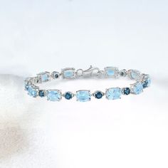 Ross-Simons - 23.10ct t. w. London, Sky Blue Topaz Bracelet in Silver. 8". Wrap your wrist in beautiful tones of blue. This bracelet features 23.10 ct. t. w. London and sky blue topaz in polished sterling silver. Lobster clasp, blue topaz bracelet. Blue Topaz birthstones are the perfect gift for December birthdays. Elegant Blue Aquamarine Bracelets, Fine Jewelry Blue Topaz Bracelets, Elegant Light Blue Aquamarine Bracelet, Luxury Blue Topaz Gemstone Bracelets, Luxury Blue Topaz Bracelets, Luxury Blue Topaz Bracelets For Formal Occasions, Luxury Blue Sterling Silver Diamond Bracelet, Luxury Blue Gemstone Tennis Bracelet, Fine Jewelry Blue Topaz Round Bracelets