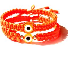 "Orange evil eye with neon orange braided macramé bracelet and accented with gold-filled beads in sizes for women's men and kids, Custom-made to your own wrist size, Bracelet is safe to get wet, Bracelet is 5mm wide and Eye bead is 8.5 mm A pretty bright orange color string with a glass orange evil eye amulet for a little more protection and good luck 𝗛𝗮𝗻𝗱𝗺𝗮𝗱𝗲 𝗴𝗶𝗳𝘁  A lovely Handmade-orange-jewelry-gift for you and loved ones  Custom made by hand with Love and care in our workshop Ready to ship today Made in USA ♡ 𝗟𝗼𝘃𝗲 𝗶𝗻 𝗮 𝘀𝘁𝗿𝗶𝗻𝗴 We hand-braid your bracelet in USA to exceed your expectations We made this good luck protection bracelet as affordable as possible so everyone can get one and also be able to gift them to loved one and friends 𝗕𝗹𝗲𝘀𝘀𝗶𝗻𝗴 𝗰𝗮𝗿𝗱 ? Handmade Orange Casual Friendship Bracelet, Casual Handmade Orange Friendship Bracelets, Orange Bohemian Jewelry For Friendship, Casual Handmade Orange Friendship Bracelet, Handmade Orange Spiritual Bracelets, Orange Bohemian Friendship Bracelets As Gifts, Orange Bohemian Friendship Bracelets Gift, Bohemian Orange Friendship Bracelets For Gift, Bohemian Orange Friendship Bracelets As Gift