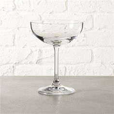 an empty wine glass sitting on top of a table