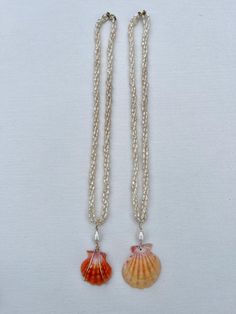 These necklaces are made of three vintage freshwater rice pearl strands and is about 16 inches long with a 14k gold filled clasp and a sunrise shell wrapped in 14k gold wire with a large baroque pearl. Rice Pearl Necklace, Sunrise Shell, Beachy Jewelry, Pearl Strands, Gold Wire, Baroque Pearls, Halloween Shopping, Fresh Water, Charm Necklace