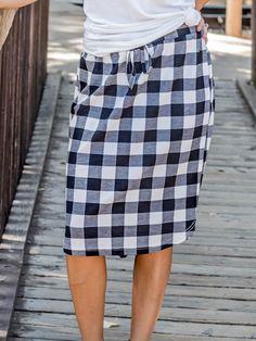 Looking for a weekend skirt that's both cozy and stylish? Look no further than our Buffalo Plaid Weekend Skirt! This skirt is the perfect combination of cute and comfortable, with a knee-length cut and a self-tie waistband that'll keep you feeling feminine and put-together all day long. Whether you're running errands or meeting up with friends for brunch, this skirt is sure to turn heads. And with sizing options ranging from S to 3X, it's easy to find the perfect fit for your body type.So why wa Feeling Feminine, Custom Coffee Mugs, Maxi Skirt Dress, Graphic Apparel, Skirt White, Custom Coffee, Knee Length Dresses, Romper Pants, Knee Length Skirt