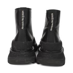 Alexander McQueen boots in black leather with a chunky rubber sole, a front lace up closure, and a white logo on the back. Includes box. Brand = Alexander McQueen Condition = 7/10, good, creasing to leather, wear to sole Size = 6.5 Material = Leather SKU = 11258-46 Leather Platform Boots With Rubber Sole For Streetwear, Modern High-top Platform Boots For Streetwear, Leather Platform Boots For Streetwear, Streetwear Platform Ankle Boots With Reinforced Heel, High-top Platform Boots With Leather Sole For Streetwear, Leather Platform Lace-up Boots For Streetwear, Modern Platform Boots For Streetwear, Leather Boots With Vibram Sole For Streetwear, Leather Streetwear Platform Boots With Reinforced Heel