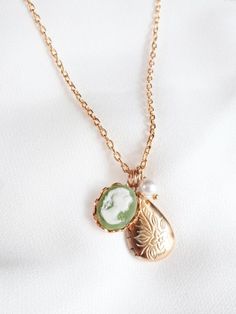 cameo locket necklace (olive green) . vintage inspired charm necklace . tiny gold locket . victorian Dainty Medallion Locket Charm Necklaces, Dainty Medallion Locket Charm Necklace, Dainty Brass Locket Charm Necklace, Dainty Pendant Locket Necklace With Vintage Charm, Dainty Charm Necklaces With Locket For Wedding, Dainty Brass Locket Necklace, Dainty Locket Charm Necklaces For Wedding, Dainty Pendant Locket Necklace, Dainty Locket Charm Necklace For Wedding