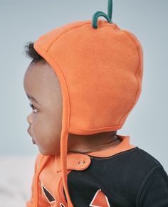 A fun Halloween take on our classic organic cotton cap for little ones. Soft and stretchy, light and protective with cute details. • Hypoallergenic & eczema-friendly • Sensory-friendly scratch-free seams that lay flat on the skin • OEKO-TEX® STANDARD 100 certified safe from hundreds of harsh chemicals 100% organic combed cotton rib knit Super-smooth flatlock seams 3-D and/or screenprint details Chin ties OEKO-TEX® STANDARD 100 | Prewashed Imported. Baby, Accessories, Hats & Headbands. | Baby Hal Sensory Friendly, Hanukkah Gifts, Unisex Accessories, Hanna Andersson, Happy Baby, Baby Halloween, Unisex Baby, Baby Hats, Jack O Lantern