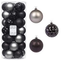 black and silver ornaments are in a clear container