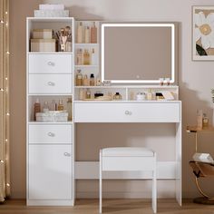 a white vanity with lighted mirror and stool next to it in a room filled with furniture