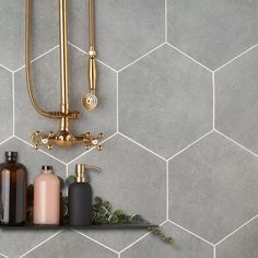 a shelf with bottles and soaps on it