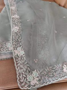 This is a fascinating pure organza silk saree in gorgeous light green color. Saree features a dazzling beads and pearl work embroidery of floral design throughout the edges of the saree. Simple pearl work is twinkling all over the body of the saree. The beads and pearl embroidery are delicately hand embellished. Organza is a lightweight plain weave fabric. The pure organza attributes to a very comfy and flowy drape. Organza is considered as one of the most stylish and glamorous wear. This is a g Pista Green Organza Saree For Wedding, Traditional Pista Green Organza Blouse Piece, Green Organza Saree With Intricate Embroidery, Intricate Embroidered Pista Green Organza Traditional Wear, Pista Green Organza Blouse Piece For Festivals, Semi-stitched Pista Green Organza Blouse Piece, Elegant Organza Blouse Piece In Pista Green, Elegant Pista Green Organza Blouse Piece, Green Organza Blouse Piece For Wedding