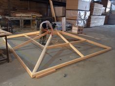 a man working on some kind of wooden structure