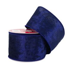 a roll of blue velvet ribbon on a white background